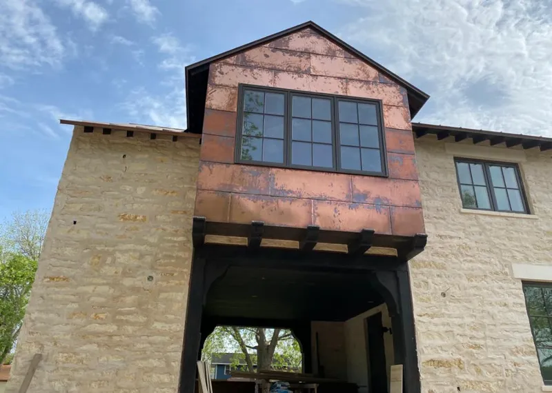 Copper metal panel facade on a stone building for Skylight Installation in Brawley